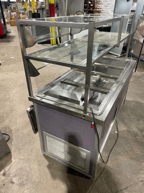 Atlas Metal 60" refrigerated salad bar with sneeze guard, 4 wells, tray slide, enclosed storage, on casters, Model WCMBT4.