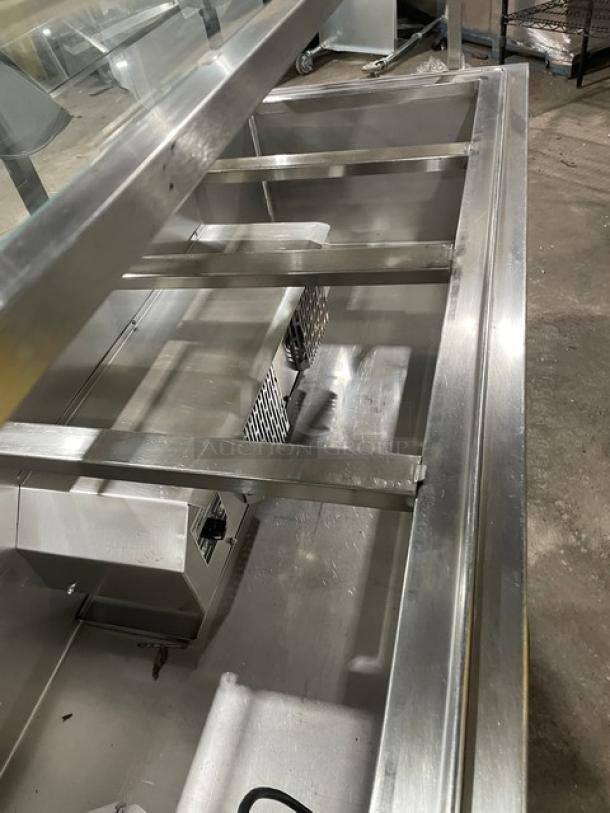 Atlas Metal 60" stainless steel refrigerated salad bar, model WCMBT4, with sneeze guard, tray slide, and storage cabinet.