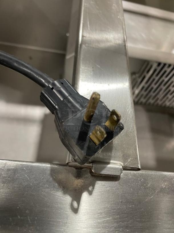 Atlas Metal WCMBT4 stainless steel refrigerated 4-well cold food bar with sneeze guard, tray slide, and enclosed storage. 115V.