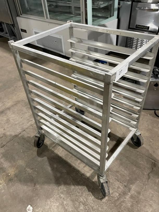 Commercial aluminum half-size heavy duty bun/sheet pan rack, on casters. Features multiple shelves, durable construction.