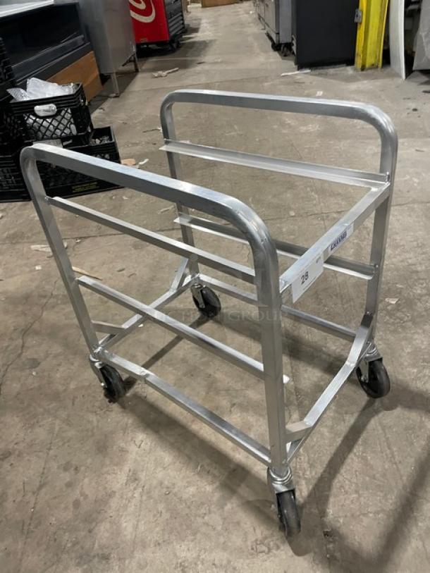Channel commercial aluminum half-size heavy duty lug rack on casters, good condition, for efficient storage or transport.