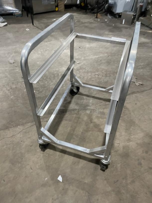 Channel commercial aluminum half-size lug rack on casters, heavy duty design, used condition, suitable for storage and transport.