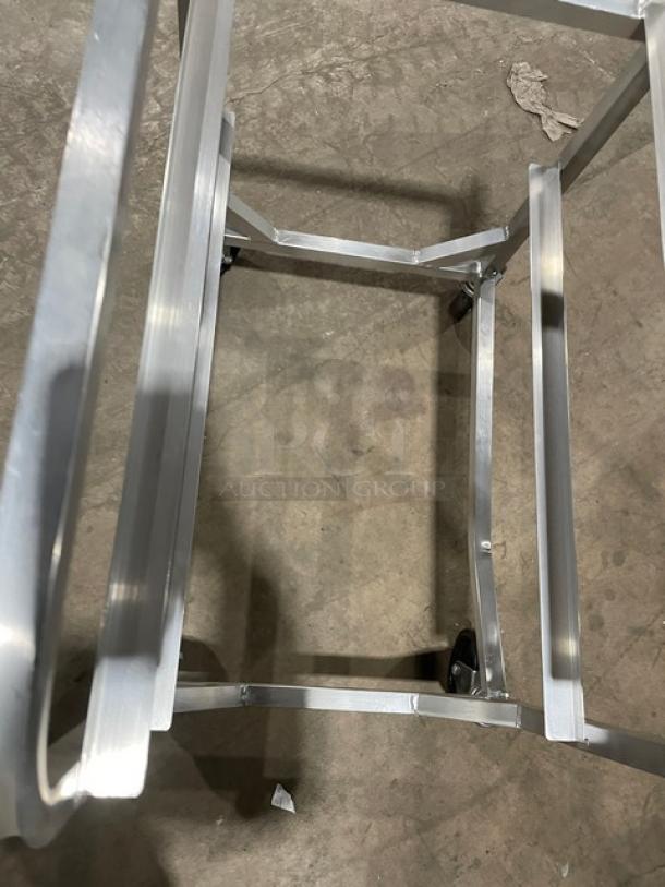 Channel aluminum half-size heavy duty lug rack on casters; robust frame, excellent condition, ideal for commercial use.