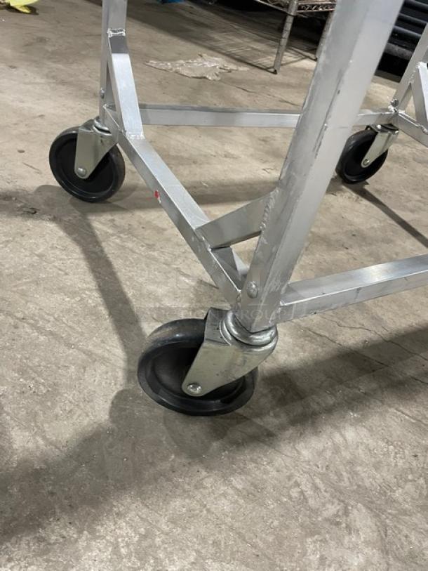 Channel aluminum lug rack on casters; half-size, heavy-duty, commercial grade, sturdy construction, excellent condition.