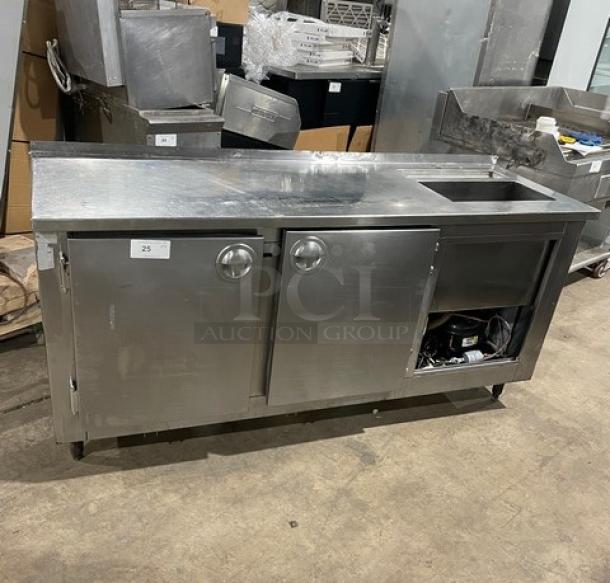 Commercial stainless steel 2-door refrigerated worktop station with single compartment sink, on legs, used condition.