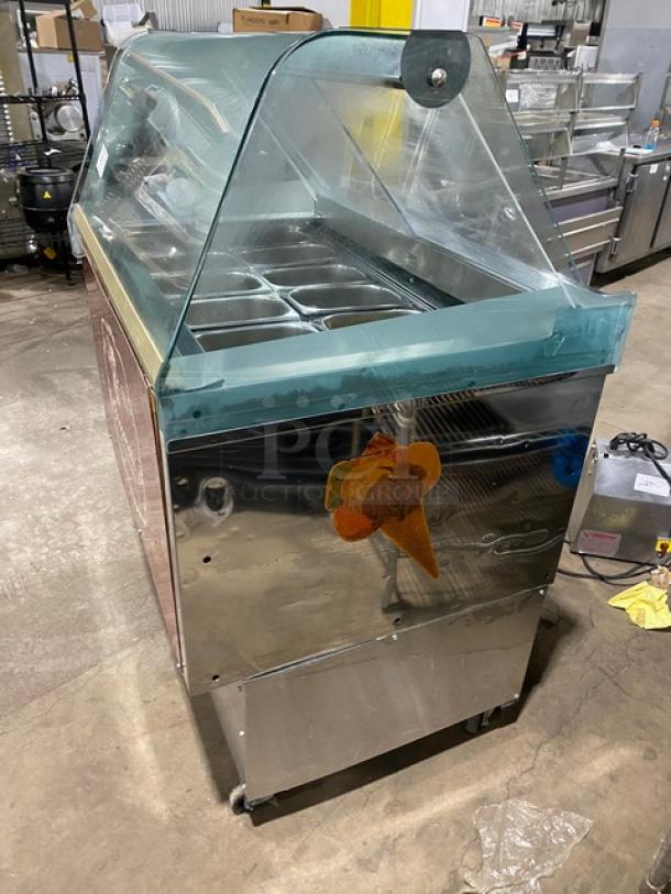 Gencarelli's Style 10-pan stainless steel gelato case with sliding door, on casters; clear dome top, cone decal.