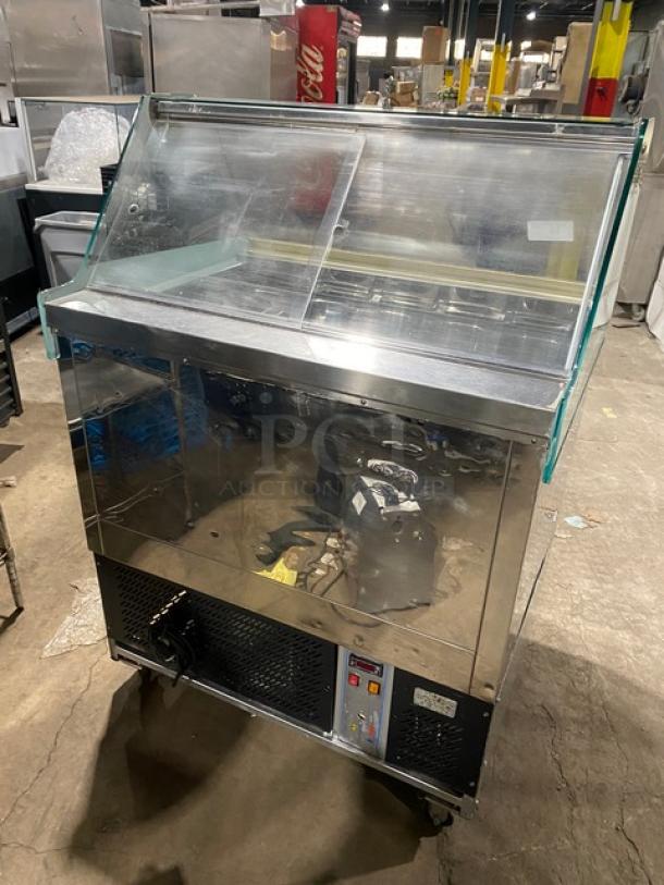 Gencarelli's Style 10-pan stainless steel gelato case with sliding doors, on casters. Good condition, ideal for commercial use.