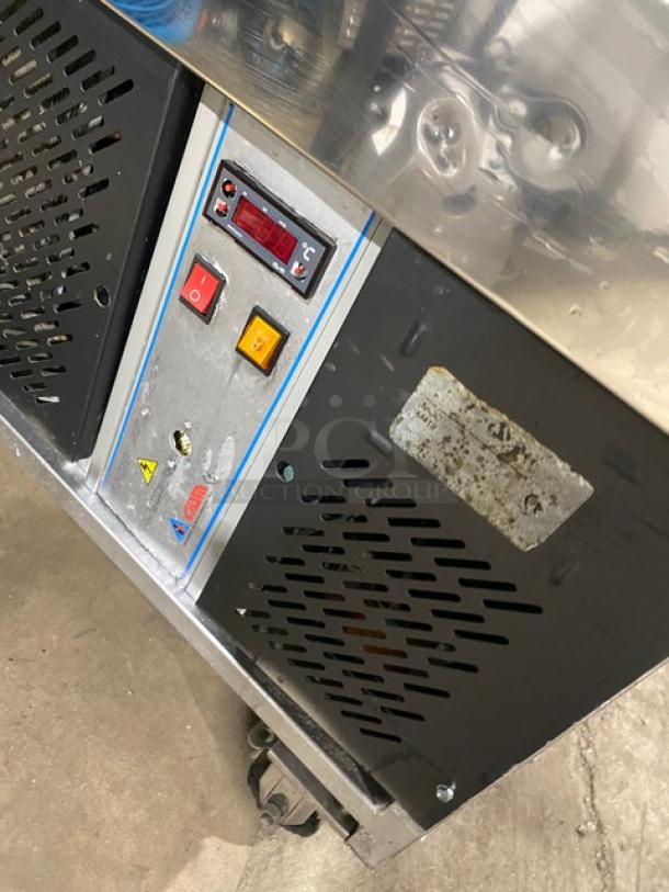 Gencarelli's Style commercial gelato case with 10-pan capacity, stainless steel, sliding door access, on casters, control panel visible.