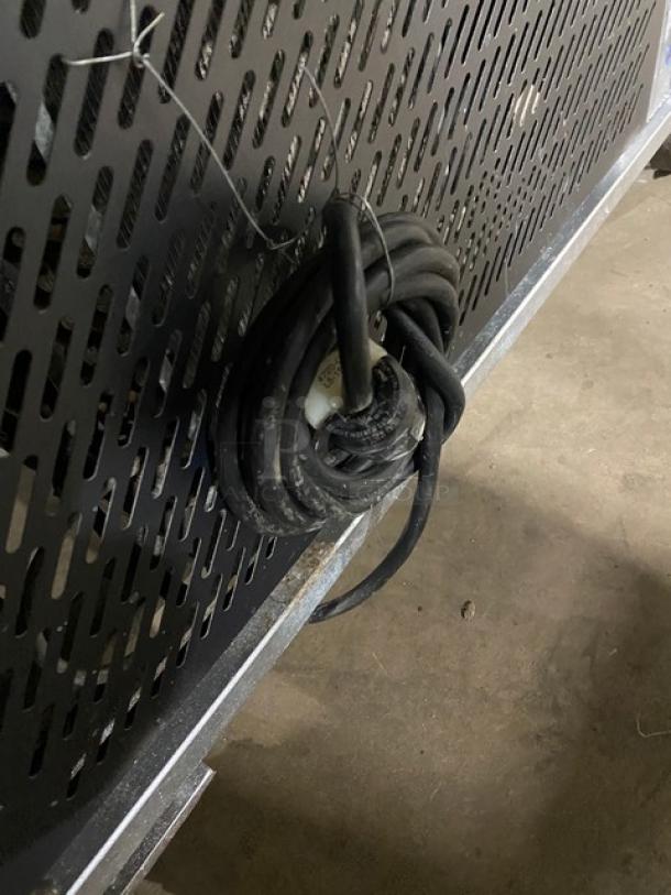 Gencarelli's Style 10-pan gelato case in stainless steel with sliding doors, on casters. Cord visible, good condition.