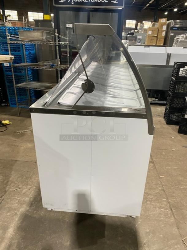 Global Baskin-Robbins style white ice cream dipping cabinet with dual lift-open doors and tub holders. Excellent condition.