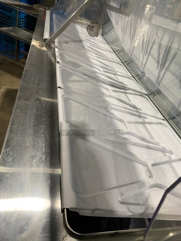 Commercial ice cream dipping cabinet by Global, Baskin Robbins style, dual lift-open doors, tub holders, stainless steel, good condition.