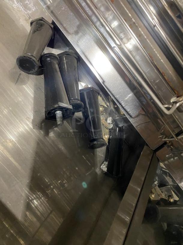 Robot Coupe commercial stainless steel electric rotisserie cabinet, shiny finish, includes detachable legs, in good condition.