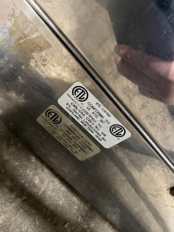 Robot Coupe stainless steel electric rotisserie cabinet, commercial-grade, with legs, ETL listed tag visible.