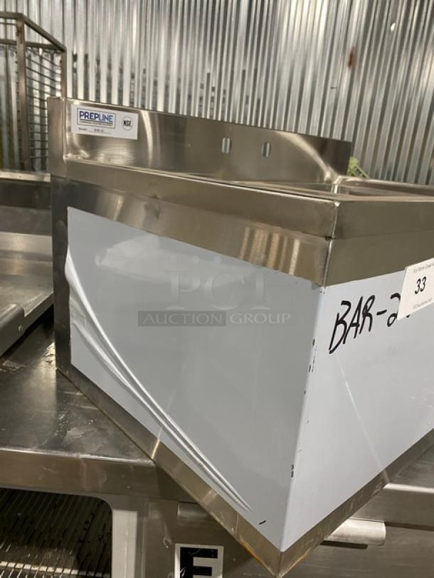 Prepline BAR-2C stainless steel 2-compartment underbar sink, new condition with 3" backsplash, scratch-n-dent label visible.