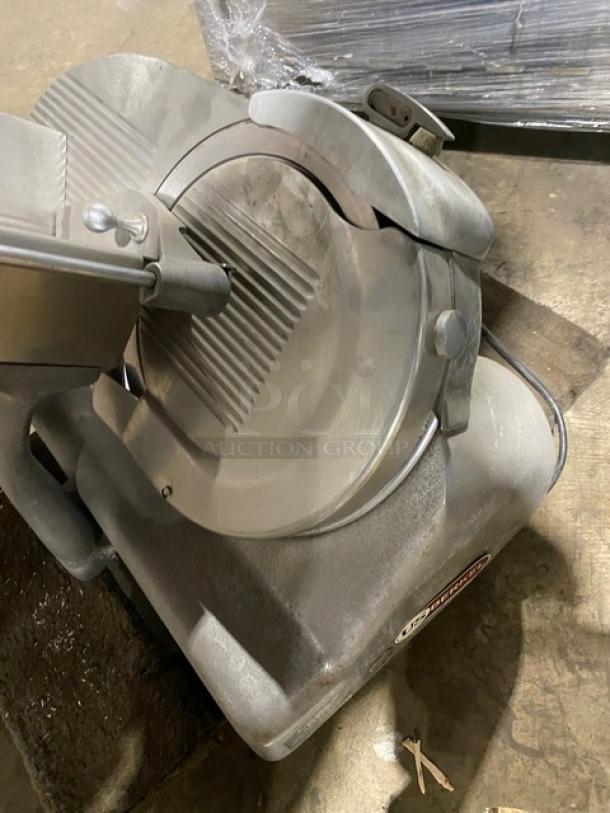 Berkel commercial electric deli slicer, heavy-duty, countertop model, stainless steel, used condition, visible brand logo.