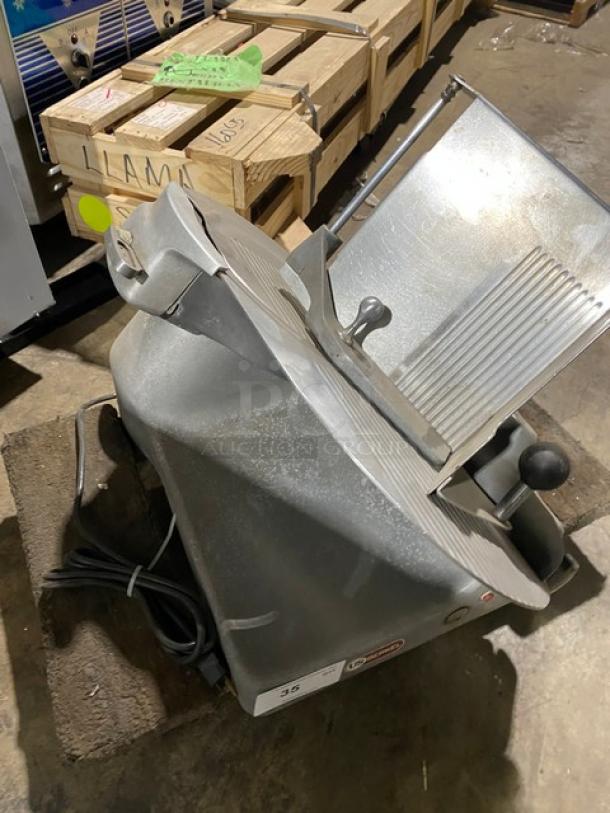 Berkel commercial electric meat slicer, used condition. Features heavy-duty design, countertop model with visible power cord.