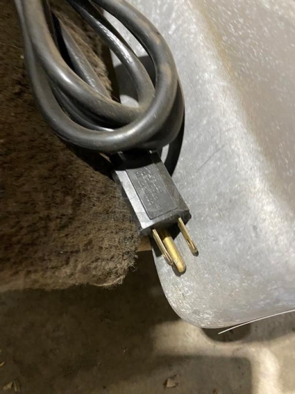 Berkel commercial electric deli slicer power cord and plug, visible in used condition.