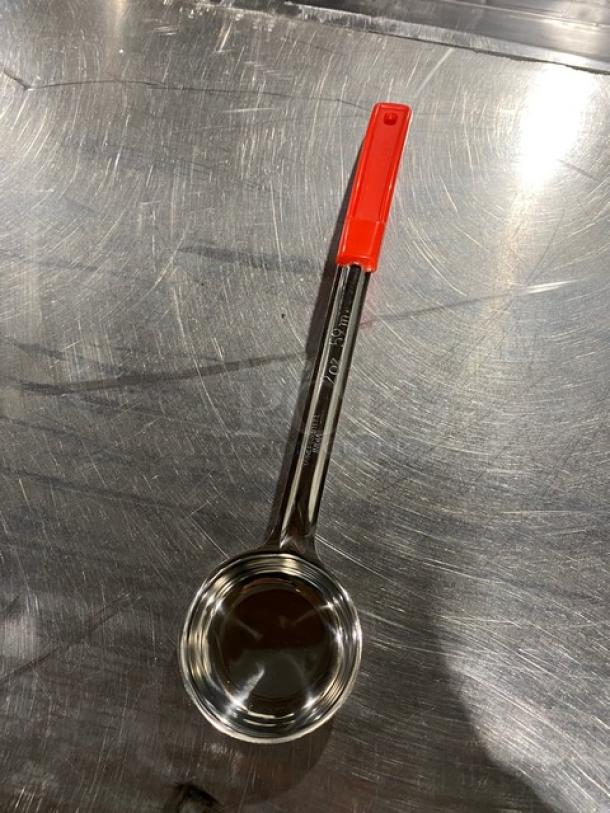 NEW Crestware SP02 stainless steel 2 oz. portion control spoon with red grip handle, in excellent condition.