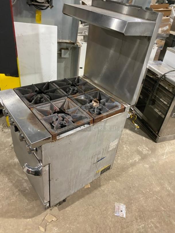 Patriot commercial stainless steel 4-burner gas range/oven combo, model FMGR-24/NG, with backsplash, salamander shelf, and wired oven rack.