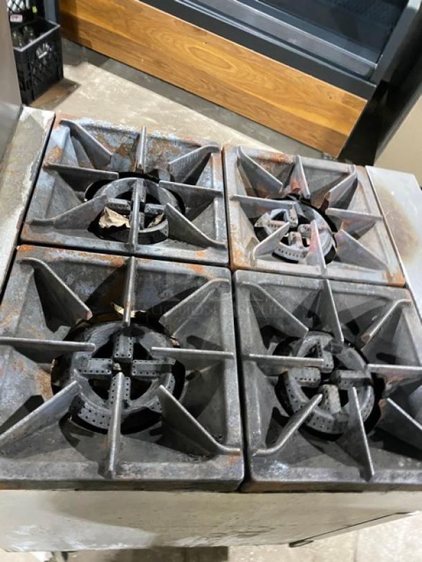 Patriot FMGR-24NG 4-burner stainless steel range/oven combo with backsplash, overhead salamander shelf, and wired oven rack.