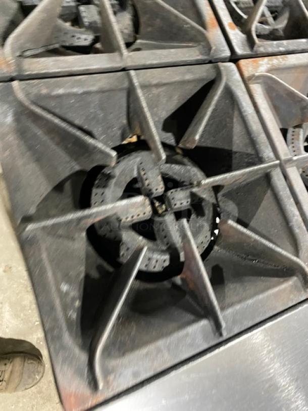 Patriot FMGR24NG stainless steel 4-burner range/oven, natural gas, with overhead salamander, back splash, and wired oven rack.