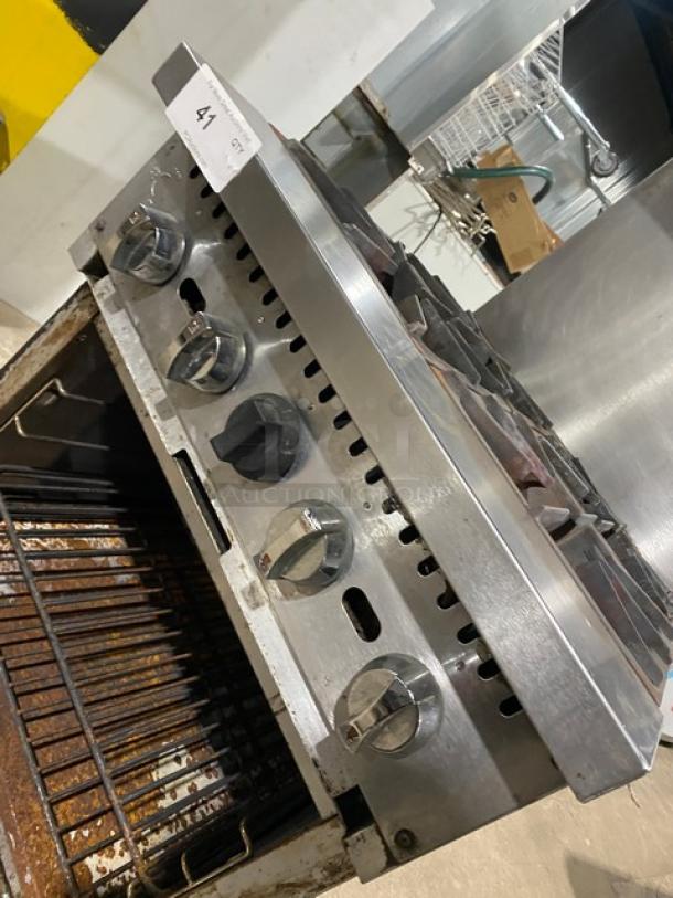 Patriot commercial 4-burner range/oven combo, model FMGR-24/NG, stainless steel, with overhead salamander shelf, wired oven rack, on casters.