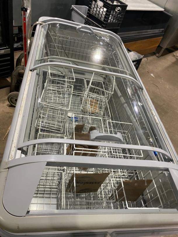 AHT Malta185 commercial ice cream merchandiser freezer, white curved-top, double glass doors, poly coated wire baskets, SN: 34886700000006.