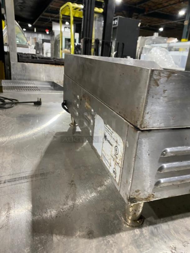 Cecilware EL1624 stainless steel electric countertop griddle, 24", with thermostatic control, back and side splash, on legs.