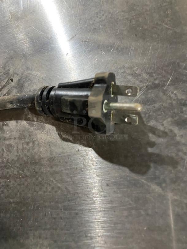 Close-up of a power plug on a Cecilware EL1624 commercial griddle. Stainless steel surface, electric powered, 240V.