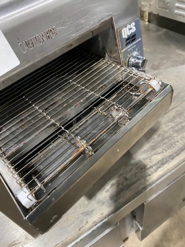 Star QCS250C stainless steel countertop conveyor toaster, quartz-convection system, visible "Caution Hot" label, used condition.