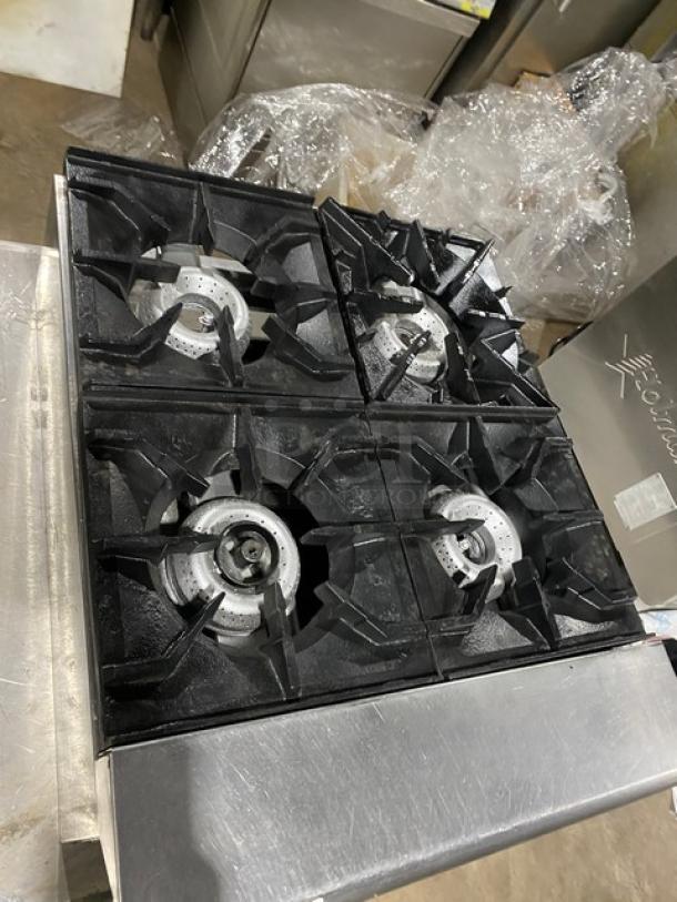 American Range commercial stainless steel gas countertop 4-burner range. Features durable black grates, good condition.