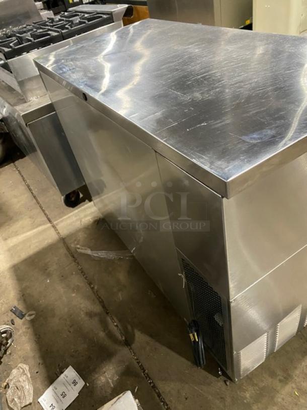 True TBB-24-48S stainless steel 2-door back bar cooler, black coated wired rack, good condition, 115V, 1 phase.