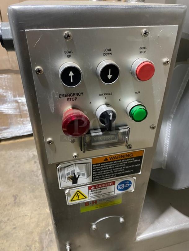 Attias Magna-Mixer 50H4C1 control panel with buttons for bowl up/down, stop, and emergency features. Warning labels visible.