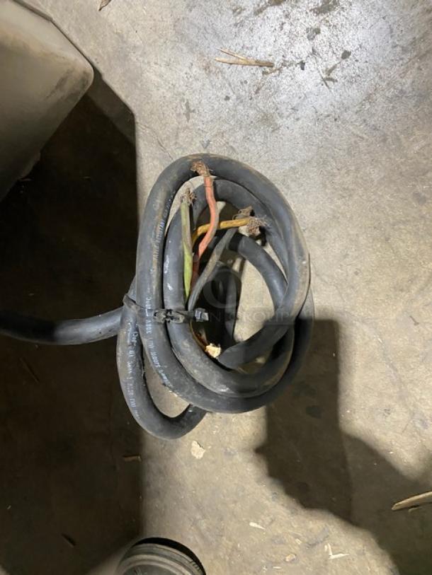 A coiled power cable for an Attias Magna-Mixer Series 50H-4C1 electric dough mixer, visible wear at ends.