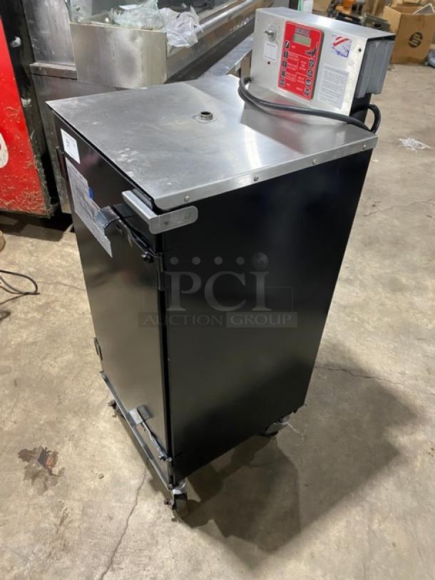 Cookshack Model 150 black electric smoker oven with digital control, 110V, SN: AC-2013, on casters, excellent condition.