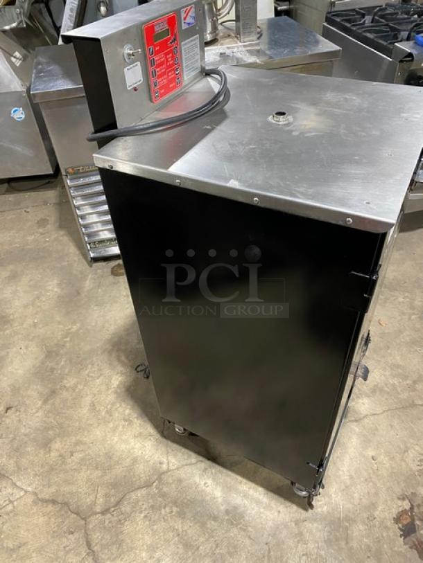 Cookshack Model 150 commercial black electric smoker oven with digital control, 110V, on casters, in good condition.