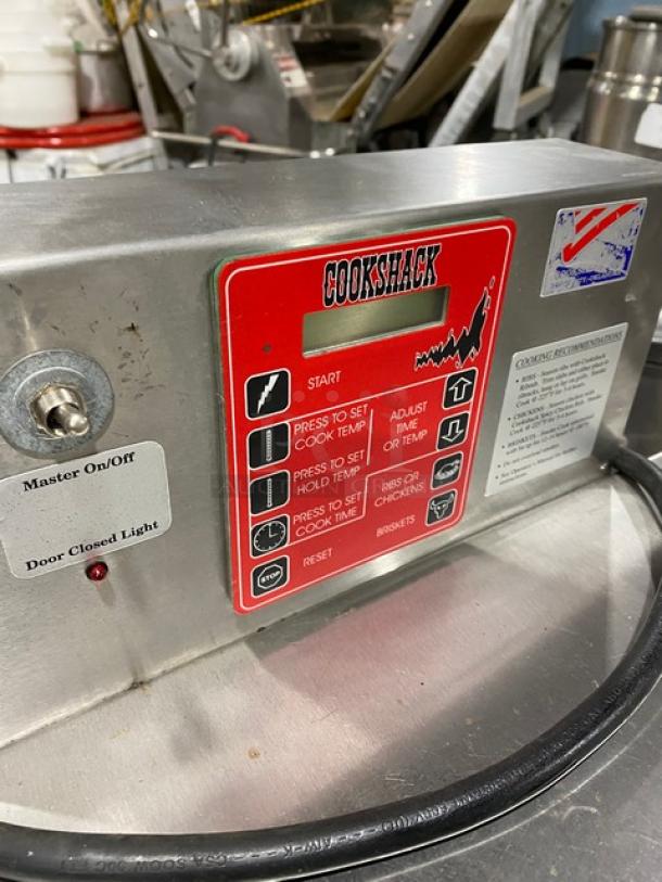 Cookshack Model 150 electric smoker oven with digital control panel, on/off switch, and timer settings. Used condition.