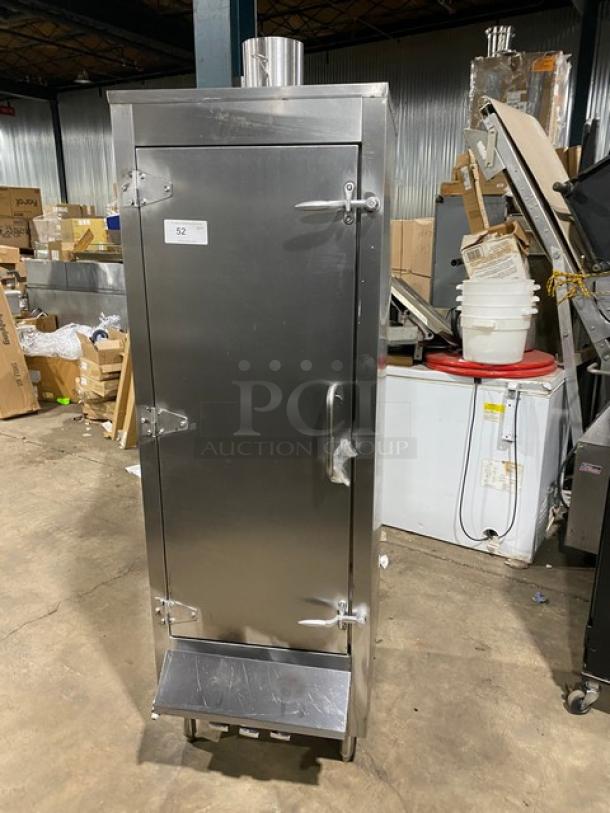 Commercial stainless steel gas-powered smoker oven. Features sturdy legs, secure latches, and a chimney. Ideal for commercial use.