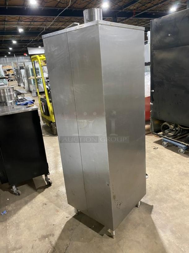 Commercial stainless steel gas-powered Chinese smoker oven on legs, in good condition. Ideal for professional kitchens.