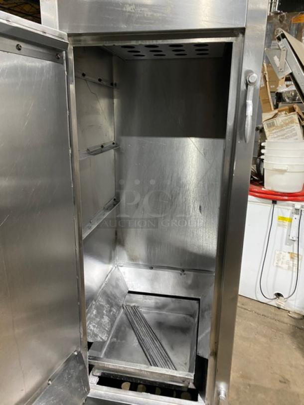 Commercial stainless steel gas-powered Chinese smoker oven on legs, open door view showing interior, used condition.