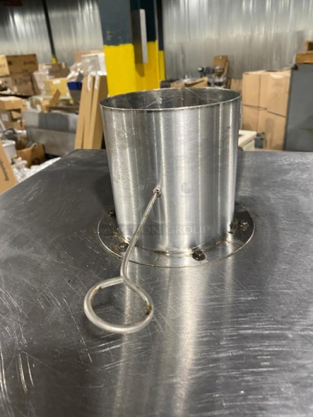 Commercial stainless steel gas smoker oven on legs, slightly used. Features a cylindrical chimney. Ideal for smoking meats.