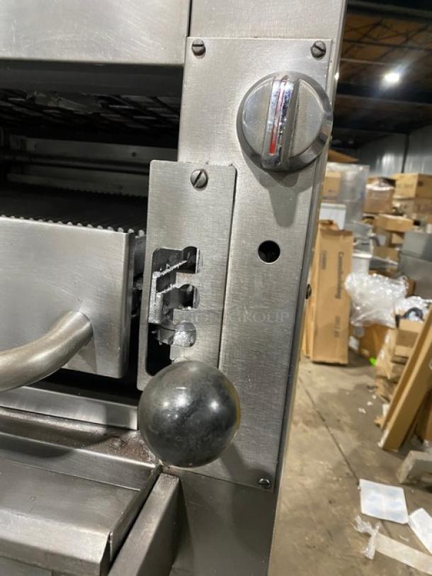 Southbend commercial stainless steel gas-powered double deck broiler in used condition, featuring control knobs and casters.