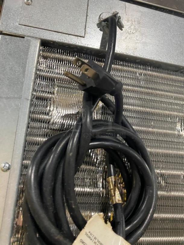 Hoshizaki KM-600MAH ice maker power cord with Energy Star tag. Coiled on stainless steel unit.