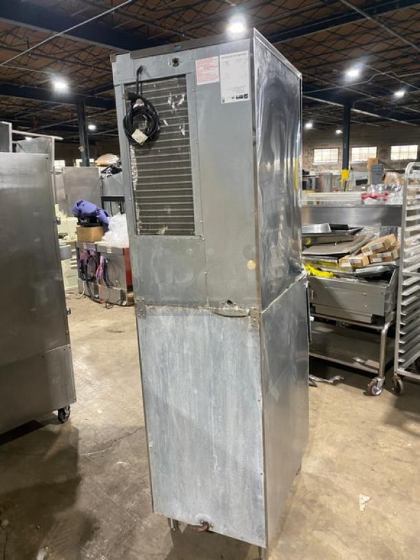 Hoshizaki KM-600MAH stainless steel ice maker, electric-powered, air-cooled, Energy Star certified, on legs, in used condition.