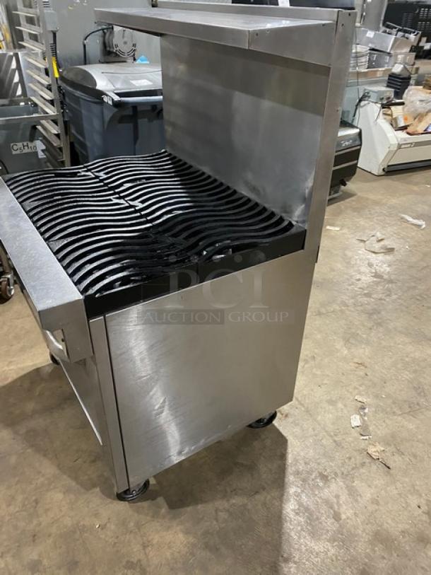 Southbend S36D commercial stainless steel 6-burner range/oven combo on casters, with non-clog wavy grates, backsplash, and salamander shelf.