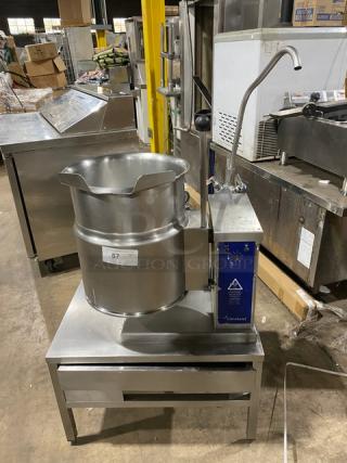 Cleveland Range KET Series stainless steel electric tilting steam kettle on legs; industrial kitchen equipment; labeled "57".