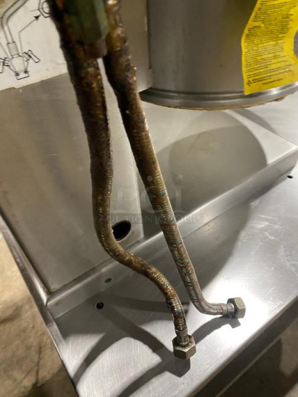 Cleveland Range KET Series stainless steel electric tilting steam kettle with attached legs, shown with labels and fittings.