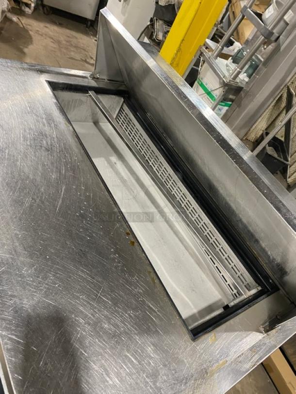 Dukers DSP48 stainless steel prep table, Bain Marie style, with wired rack, 115V, on casters, visible wear.