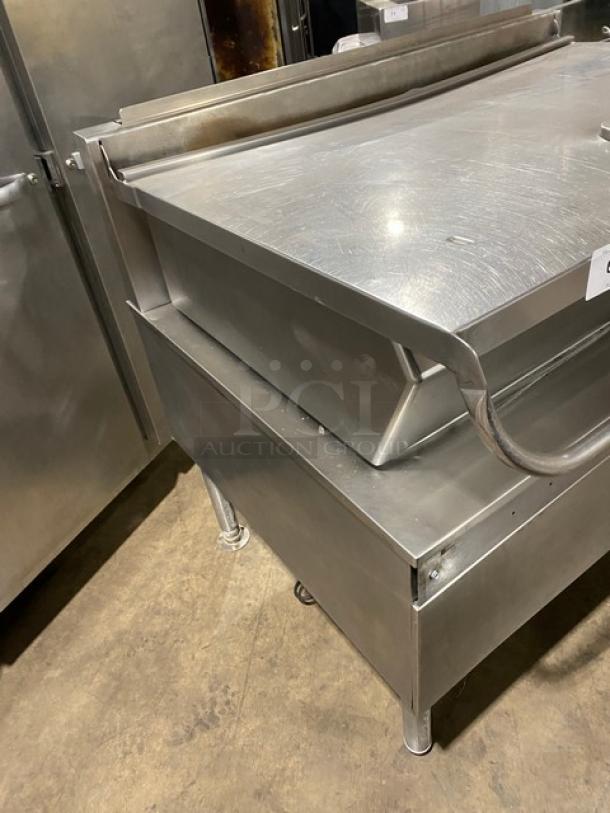 Cleveland Range stainless steel tilted braising pan on legs, commercial-grade, durable, with visible handle and sturdy construction.
