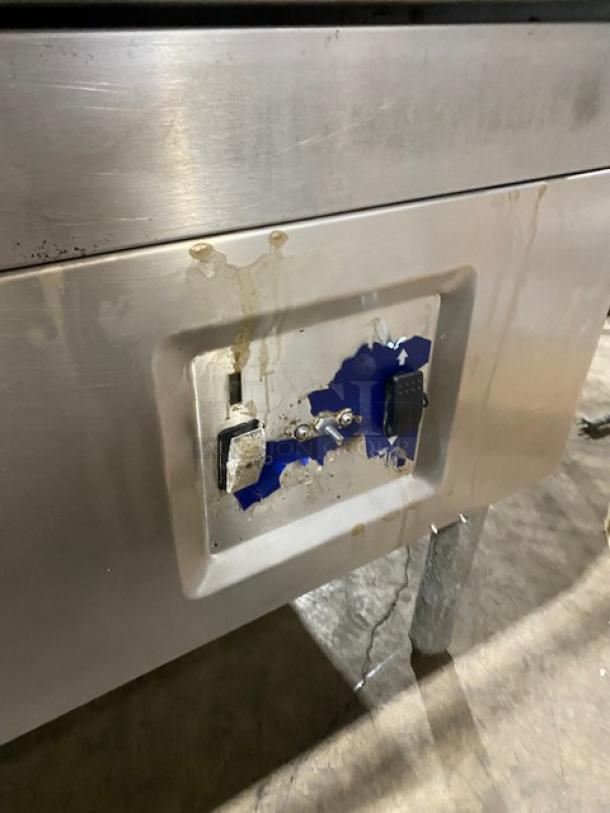 Cleveland Range commercial stainless steel tilted braising pan on legs, visible wear and control panel damage.